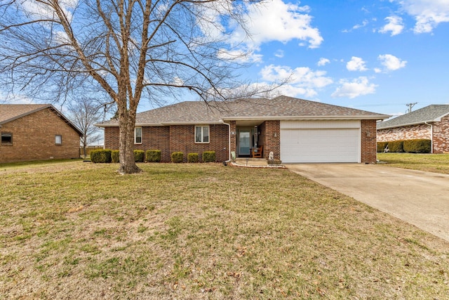 ranch-style house with a front yard, concrete driveway, brick siding, and an attached garage