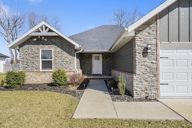 view of front of property with brick siding, a shingled roof, stone siding, an attached garage, and a front yard