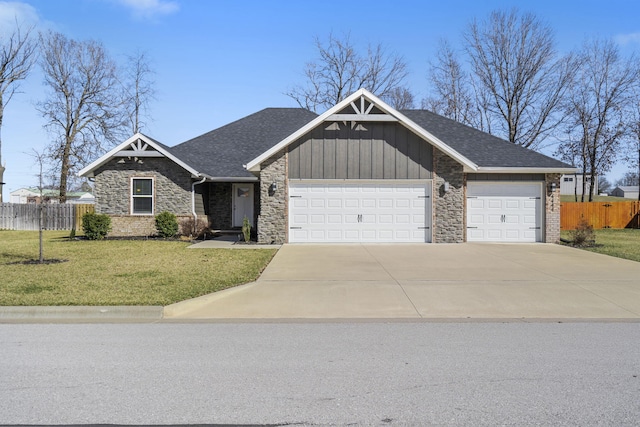 view of front of house with a shingled roof, concrete driveway, an attached garage, fence, and a front lawn