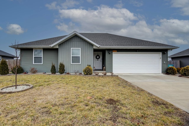 ranch-style home featuring a front yard, roof with shingles, driveway, and an attached garage