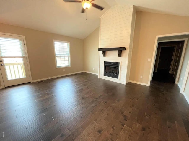 unfurnished living room featuring baseboards, dark wood finished floors, ceiling fan, a fireplace, and high vaulted ceiling