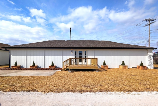 back of property featuring a deck