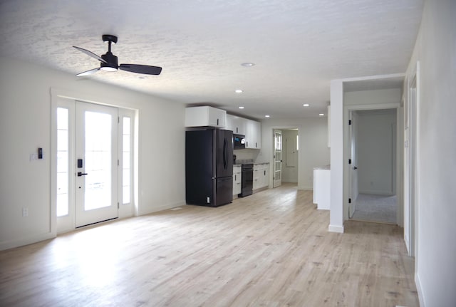 unfurnished living room featuring baseboards, ceiling fan, a textured ceiling, light wood-style floors, and recessed lighting