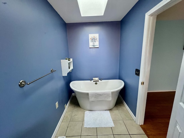 109 Lancashire Dr, Branson, MO 65616 - bathroom featuring baseboards, a freestanding tub, and tile patterned flooring