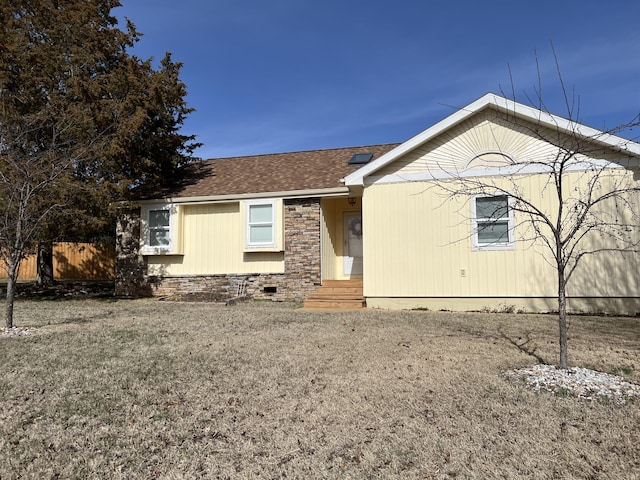 ranch-style house featuring crawl space, roof with shingles, and fence