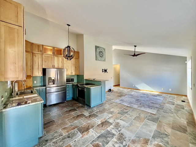 109 Lancashire Dr, Branson, MO 65616 - kitchen featuring stone finish flooring, stainless steel appliances, a sink, ceiling fan with notable chandelier, and open floor plan