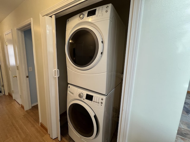 109 Lancashire Dr, Branson, MO 65616 - laundry area with light wood-style floors, stacked washing maching and dryer, and laundry area