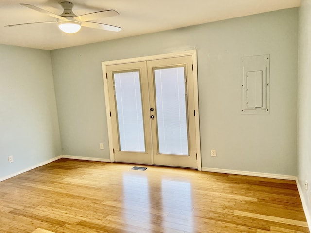 109 Lancashire Dr, Branson, MO 65616 - spare room featuring french doors, baseboards, light wood-style floors, ceiling fan, and electric panel
