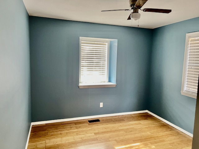 109 Lancashire Dr, Branson, MO 65616 - empty room featuring a ceiling fan, wood finished floors, baseboards, and a wealth of natural light