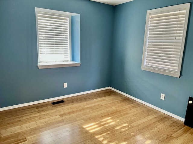 109 Lancashire Dr, Branson, MO 65616 - empty room with baseboards, visible vents, and hardwood / wood-style flooring