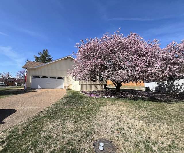 109 Lancashire Dr, Branson, MO 65616 - view of front of property with an attached garage, concrete driveway, and a front yard