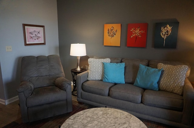 living room with wood finished floors and baseboards