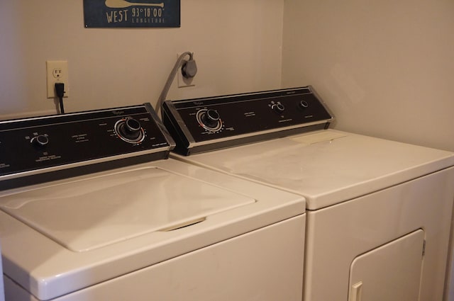 clothes washing area with laundry area and washing machine and dryer