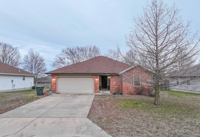 ranch-style house featuring a front lawn, brick siding, driveway, and an attached garage