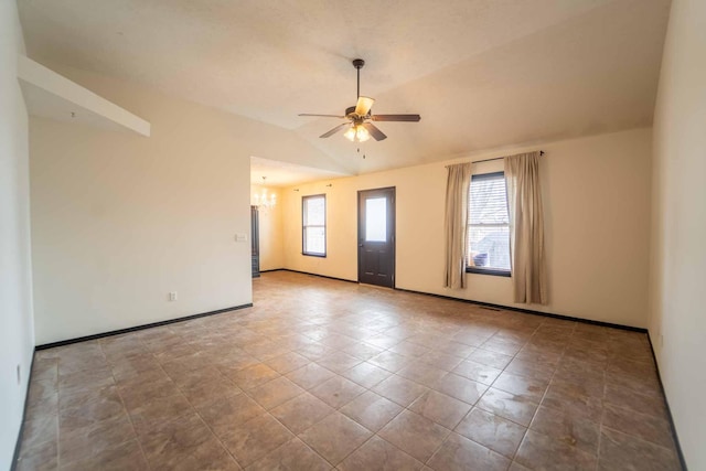 unfurnished room with lofted ceiling, a healthy amount of sunlight, baseboards, and ceiling fan with notable chandelier