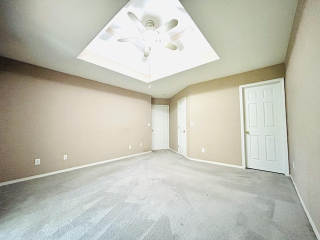 empty room featuring carpet, ceiling fan, and baseboards