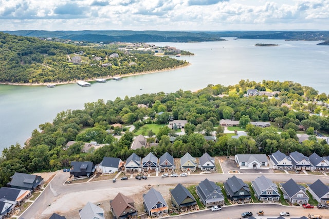 birds eye view of property with a water view and a residential view