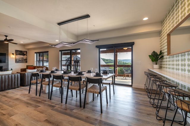 dining room featuring recessed lighting, ceiling fan, baseboards, and wood finished floors