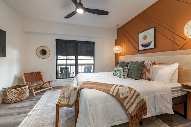 bedroom featuring wood finished floors and a ceiling fan