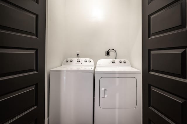 laundry area featuring laundry area and washer and clothes dryer