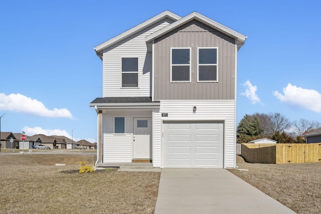 traditional-style house with an attached garage, driveway, fence, and board and batten siding