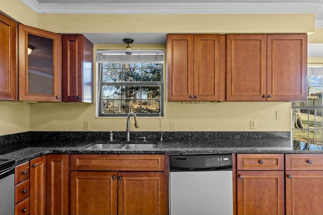 kitchen with a sink, ornamental molding, stainless steel dishwasher, dark stone countertops, and glass insert cabinets