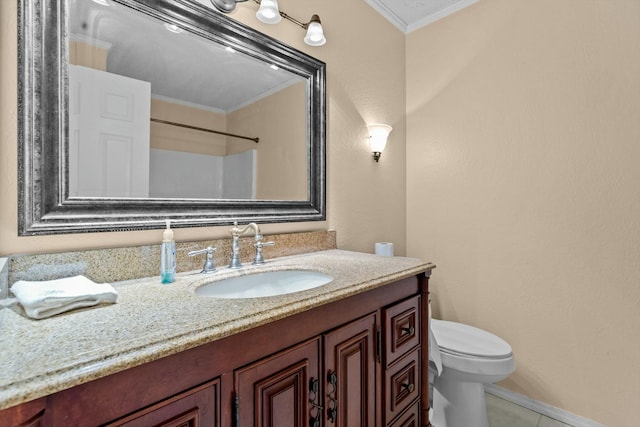 bathroom with baseboards, toilet, tile patterned flooring, crown molding, and vanity