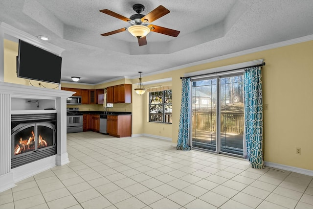 unfurnished living room featuring a tray ceiling, a textured ceiling, and light tile patterned floors