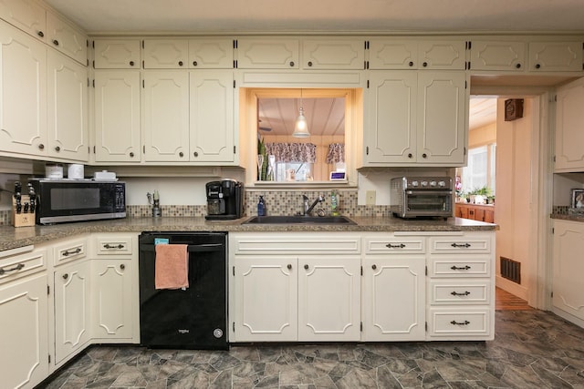 kitchen with a toaster, a sink, visible vents, white cabinets, and black appliances