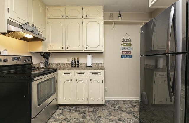 kitchen featuring freestanding refrigerator, under cabinet range hood, electric range, and baseboards