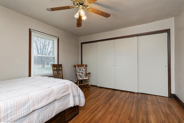 bedroom featuring a closet, ceiling fan, and wood finished floors