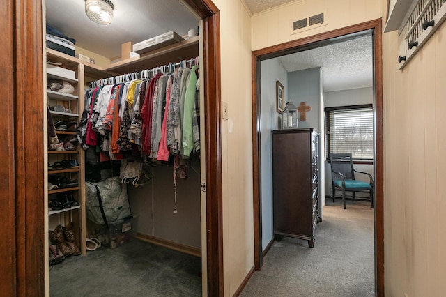 walk in closet featuring carpet floors and visible vents