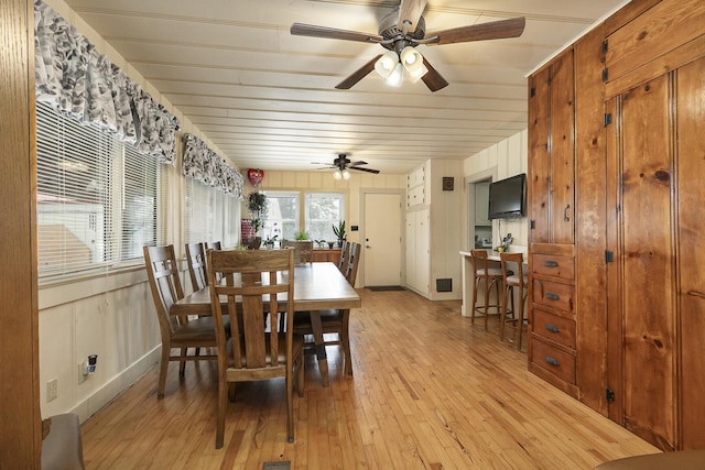 dining space featuring light wood-type flooring, ceiling fan, and wood ceiling