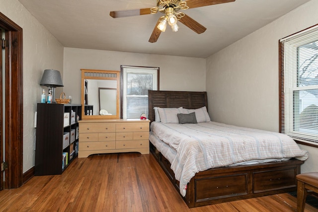 bedroom featuring ceiling fan and wood finished floors