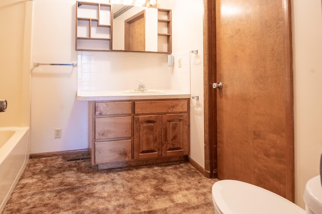 full bathroom with tasteful backsplash, vanity, toilet, and a tub