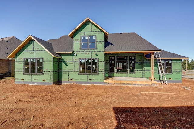 view of front of home featuring crawl space and a shingled roof