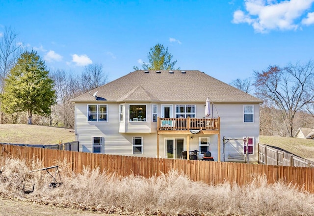 back of house with a wooden deck and fence private yard