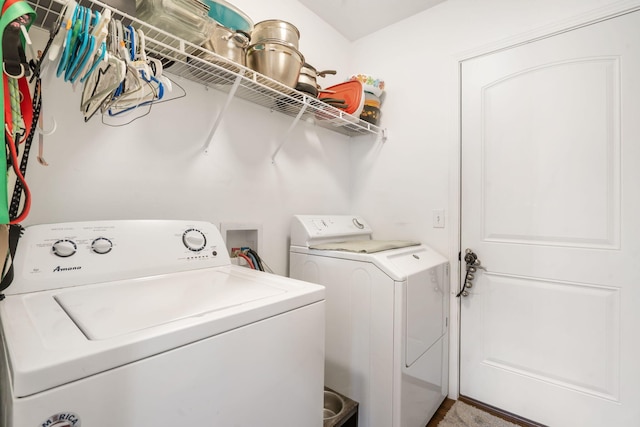 laundry area featuring washing machine and clothes dryer and laundry area