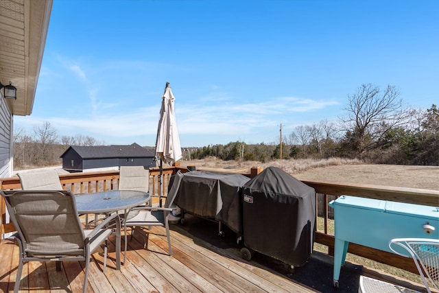 wooden deck featuring outdoor dining space