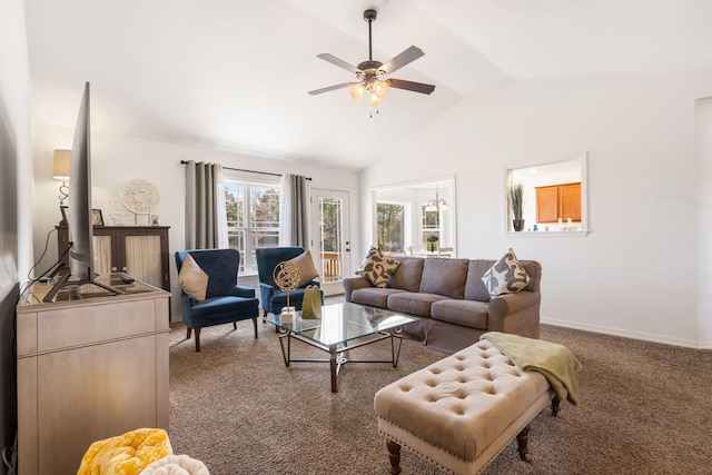 living area with baseboards, lofted ceiling, a ceiling fan, and carpet flooring