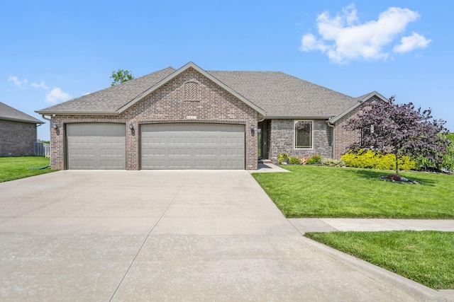 4427 E Kentbrook Dr, Springfield, MO 65802 - view of front of house with a garage, driveway, a front yard, roof with shingles, and brick siding