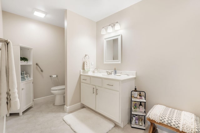 4427 E Kentbrook Dr, Springfield, MO 65802 - bathroom with vanity, toilet, and baseboards