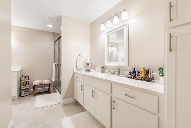 4427 E Kentbrook Dr, Springfield, MO 65802 - full bathroom featuring vanity, a shower stall, tile patterned flooring, recessed lighting, and baseboards