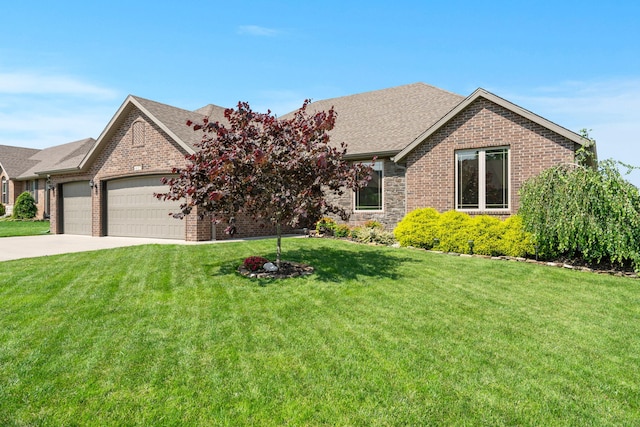 4427 E Kentbrook Dr, Springfield, MO 65802 - view of front of home featuring a garage, brick siding, driveway, and a front lawn