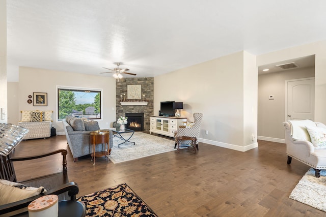 4427 E Kentbrook Dr, Springfield, MO 65802 - living room with ceiling fan, a stone fireplace, wood finished floors, and baseboards