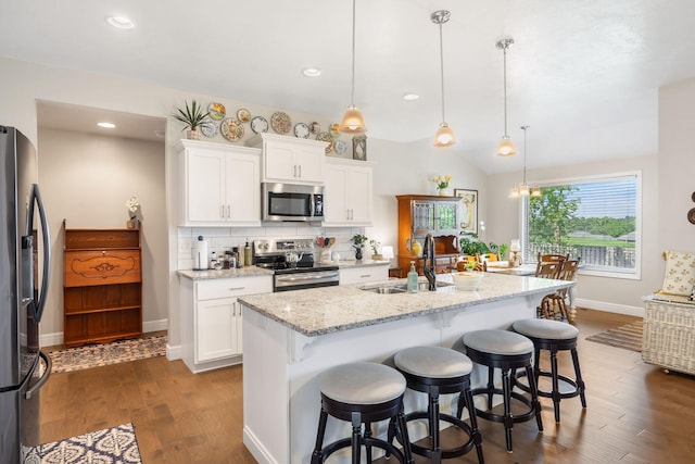4427 E Kentbrook Dr, Springfield, MO 65802 - kitchen featuring appliances with stainless steel finishes, a sink, baseboards, dark wood-style flooring, and white cabinetry