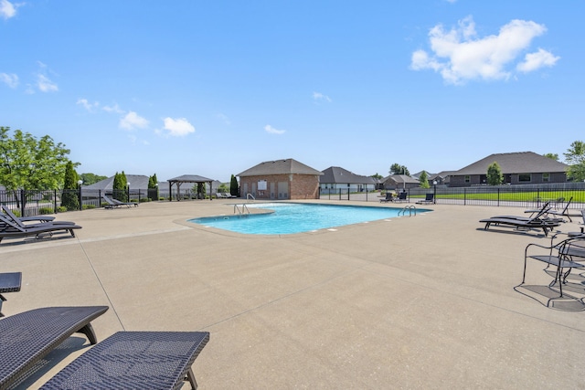 4427 E Kentbrook Dr, Springfield, MO 65802 - community pool featuring a patio, a gazebo, and a residential view