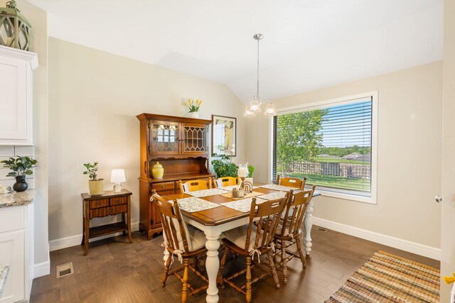 4427 E Kentbrook Dr, Springfield, MO 65802 - dining space featuring a chandelier, baseboards, dark wood-type flooring, and vaulted ceiling
