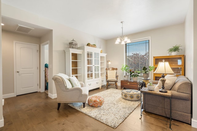 4427 E Kentbrook Dr, Springfield, MO 65802 - living area with a chandelier, wood finished floors, and baseboards
