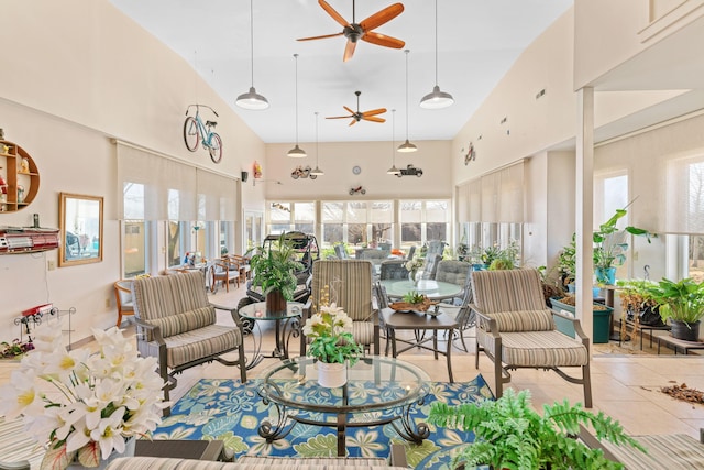 tiled living room featuring a high ceiling and a ceiling fan